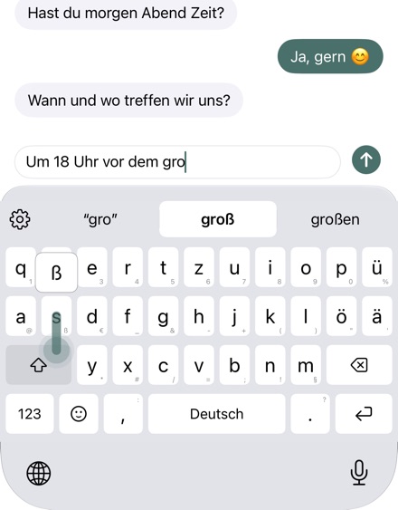 Wisch nach unten auf einer Taste: Die Vorschau zeigt das Zeichen.